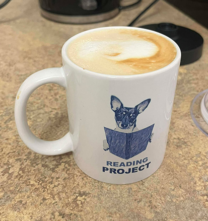 Reading Project mug with coffee