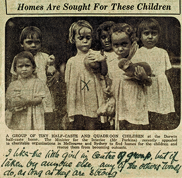 A photo of light-skinned aboriginal children which has been marked with an x to show a preferred child